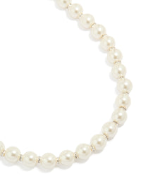 Elegant pearl and diamante rondell necklace crafted from silver plated material close up view - link has visual effect only
