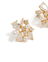 Showcasing gold plated cubic zirconia and pearl cluster stud earrings close up view - link has visual effect only