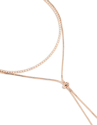 Showcasing a rose gold plated cubic zirconia cup chain and snake layered Y-necklace with crystal accents close up view - link has visual effect only