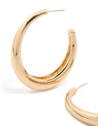 Featuring gold plain wide hoop earrings close up view - link has visual effect only