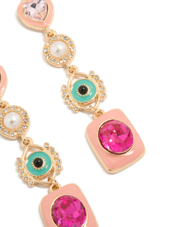 Featuring gold enamel celestial drop earrings with evil-eye, pearl, heart, hamsa hand and charm details in pink and turquoise, statement style close up view