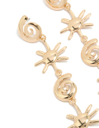 Showcasing statement gold shell and sun drop earrings with celestial and ocean-inspired design close up view - link has visual effect only