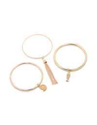 Showcasing gold charm and tassel bangles in a 3-pack featuring shell and ocean-inspired designs front view - link has visual effect only