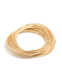 Worn gold multi crossover bangle front view - link has visual effect only