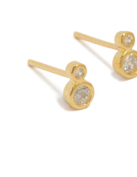 Presenting dainty stud earrings crafted from gold plated sterling silver with cubic zirconia in a double bezel setting close up view - link has visual effect only