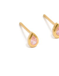 Showcasing gold plated sterling silver cubic zirconia teardrop stud earrings with light pink stones close up view - link has visual effect only