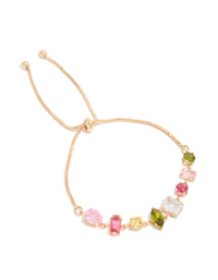 Beautifully designed gold pink and green mismatched cubic zirconia toggle bracelet featuring multicolored accents front view - link has visual effect only