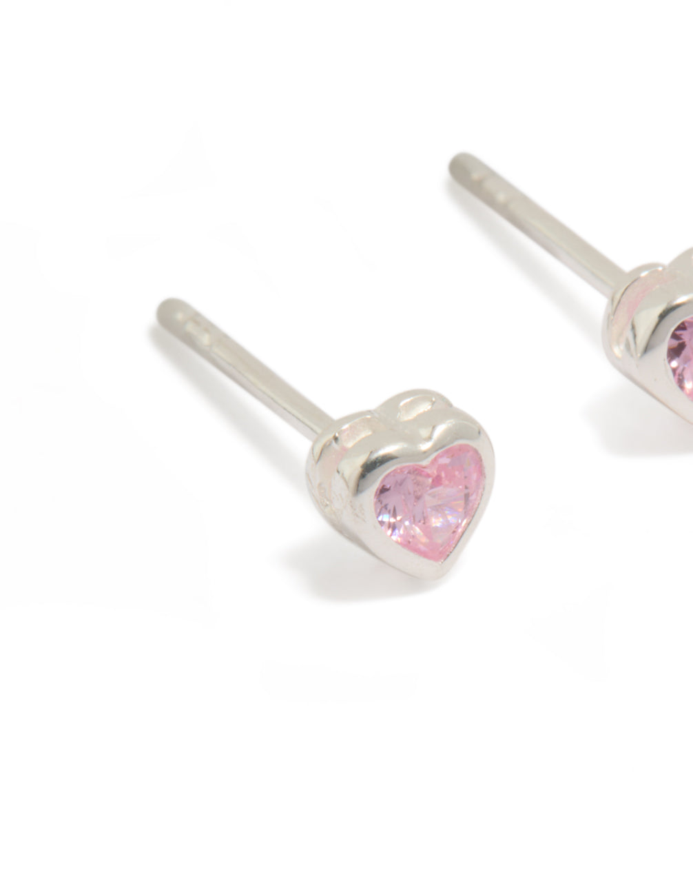 Highlighting sterling silver pink cubic zirconia heart earrings close up view