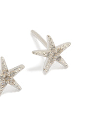 Showcasing dainty sterling silver cubic zirconia starfish earrings with ocean-inspired design post detail view - link has visual effect only