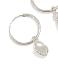 Beautiful statement hoop earrings crafted from sterling silver with heart and key featuring padlock detail close up view - link has visual effect only