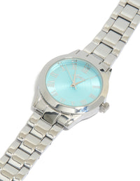Beautifully crafted women's watch featuring roman numeral blue dial with round shape, casual analog design, and link band strap in silver watch face detail view - link has visual effect only