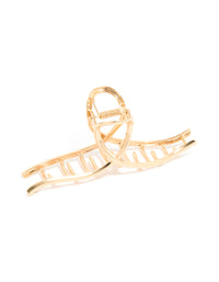 Showcasing a gold wavy claw clip side view - link has visual effect only