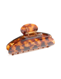 Crafted with a tortoiseshell pattern this arched claw clip in chocolate sienna and peru hues side view - link has visual effect only
