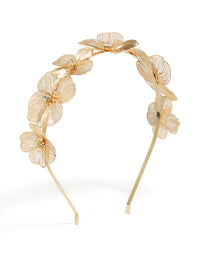 Showcasing a laser cut flowers headband in gold front view - link has visual effect only
