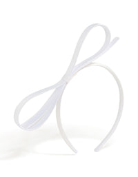Showcasing a white thin bow headband with dainty in solid front view - link has visual effect only