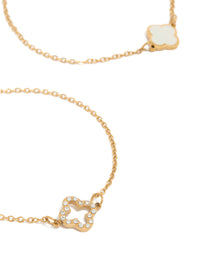Showcasing waterproof floral bracelets crafted from stainless steel with cubic zirconia in dainty gold plated style 2-pack close up view - link has visual effect only