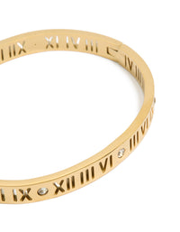 Crafted from waterproof gold plated stainless steel, this cubic zirconia roman numeral hinged bangle close up view - link has visual effect only