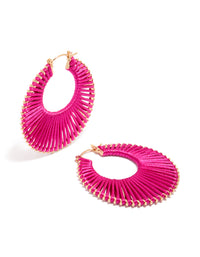 Showcasing statement hoop earrings in hot pink and gold front view - link has visual effect only