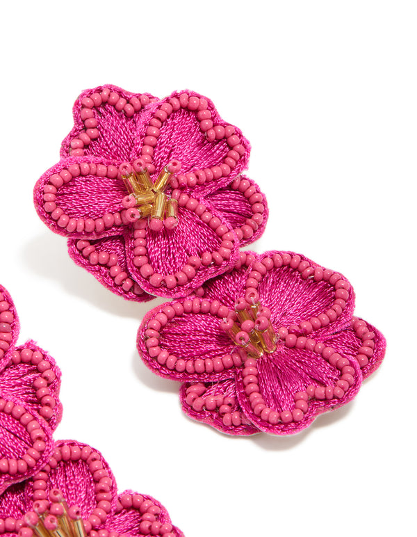 Featuring statement hot pink fabric beaded double flower drop earrings post detail view