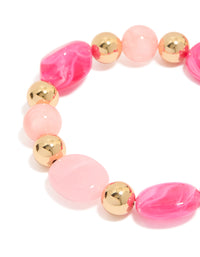 Featuring beaded stretch bracelet in hot pink, light pink, and gold acrylic 2-pack close up view - link has visual effect only