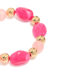 Featuring beaded stretch bracelet in hot pink, light pink, and gold acrylic 2-pack close up view - link has visual effect only