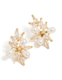 Crafted from gold plated metal, these statement organic flower earrings with pearls and cubic zirconia in ivory tones front view - link has visual effect only