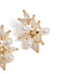 Showcasing organic flower statement earrings in gold plated metal with pearls and cubic zirconia in ivory post detail view - link has visual effect only