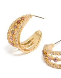 Featuring gold plated cubic zirconia triple hoop medium earrings with intricate stone settings close up view - link has visual effect only