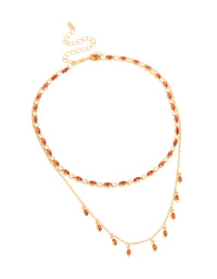 Beautifully designed gold plated red cubic zirconia tennis and teardrop charm layer necklace with statement styling front view - link has visual effect only