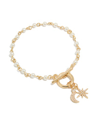 Showcasing a gold plated pearl and cubic zirconia bracelet featuring celestial star moon charm fob front view - link has visual effect only