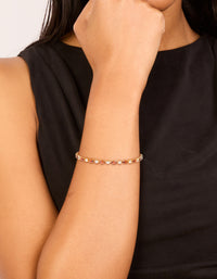 Featuring a gold plated clear and cognac cubic zirconia multi cut tennis bracelet on wrist view - link has visual effect only