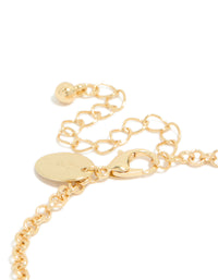 Highlighting a gold plated bracelet with cognac beads and clear cubic zirconia in a tennis style closure detail view - link has visual effect only