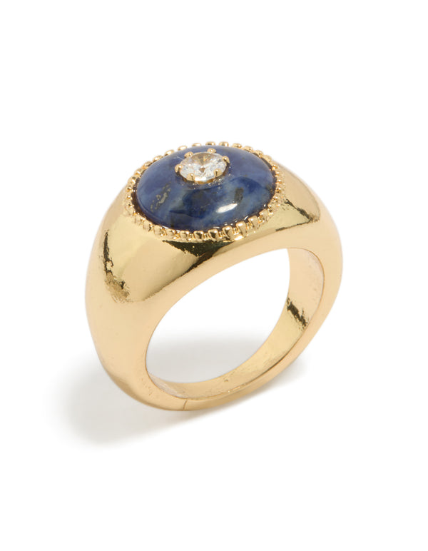Featuring a gold plated chunky cubic zirconia blue stone ring with clear design side detail view