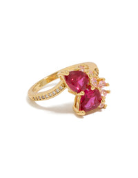 Showcasing a gold plated statement ring with double pear cut red and light pink cubic zirconia side detail view - link has visual effect only