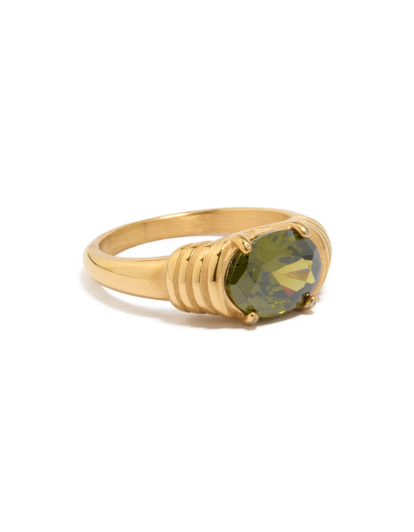 Featuring a waterproof gold plated stainless steel ring with oval green cubic zirconia crystal in chunky style side detail view