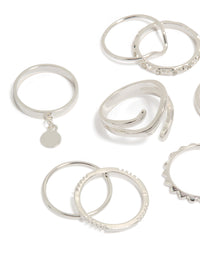 Crafted from silver, this mixed swirl stacking rings 8-pack with charm and disc details close up view - link has visual effect only