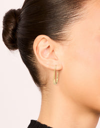 Designed with waterproof stainless steel oval earrings in 30mm featuring closure and silver finish on ear view - link has visual effect only