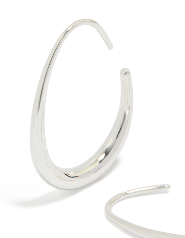 Featuring waterproof stainless steel oval earrings in 30mm with closure and silver finish close up view