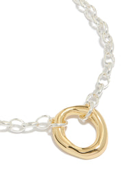 Showcasing a waterproof mixed metal plated stainless steel organic round pendant necklace in gold and silver close up view - link has visual effect only