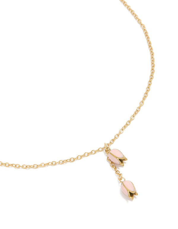 Showcasing a waterproof gold plated stainless steel pink tulips pendant necklace with floral in dainty style close up view