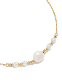 Beautifully crafted waterproof gold plated stainless steel pearls chain necklace featuring balls in a statement style close up view - link has visual effect only