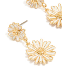 Showcasing gold plated white enamel double daisy drop earrings with floral close up view - link has visual effect only