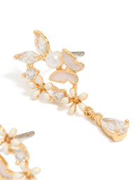 Showcasing gold plated cubic zirconia and pink enamel butterfly cluster drop earrings featuring pearl accents and pear stone cut close up view - link has visual effect only