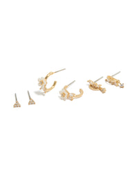Showcasing dainty huggie earrings with butterfly and floral details, crafted from gold plated crystal cubic zirconia in a 3-pack front view - link has visual effect only