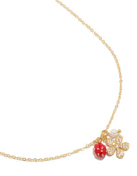 Showcasing a delicate charm necklace featuring strawberry fruit, pearl, and flower pendants with crystal and cubic zirconia details, close up view - link has visual effect only