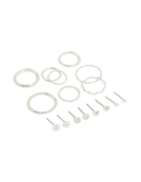 Showcasing dainty stud earrings featuring pearl and ball designs, along with rings in a 12-piece set with a silver finish front view - link has visual effect only