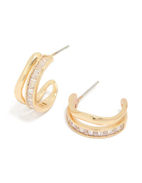 Showcasing statement style hoop earrings with baguette cut stones in gold plated wave layered design front view - link has visual effect only