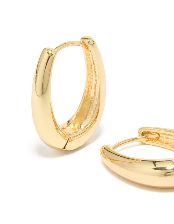 Featuring gold plated skinny teardrop hoop earrings with closure mechanism in close up view