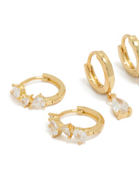 Crafted from gold plated material, these pear cut cubic zirconia huggie and stud earrings in a 3-pack feature crystal details close up view - link has visual effect only