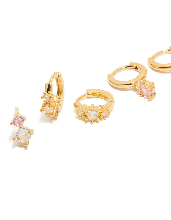 Discover mini double cubic zirconia studs and huggie earrings in a 3-pack set with crystal detailing and gold plated finish close up view